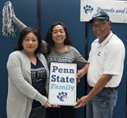 Mom, dad, and student at Parents & Families Weekend