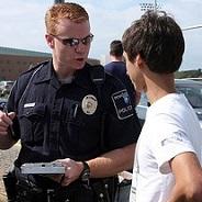 Police officer talks to student