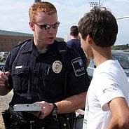 police officer talks to student