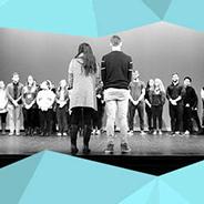 Students onstage at All That We Are event