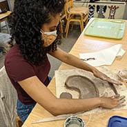 Student working with clay