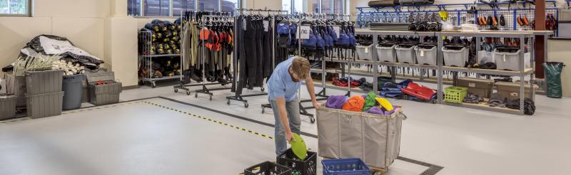 Man sorting out gear for rental