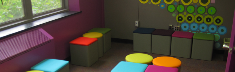 Colorful chairs in the colorful LGBTQA SRC discussion group room