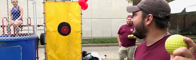 Off Campus Student Union members host a dunk booth at LionBASH