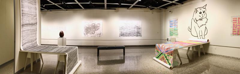 A panoramic view of the Manual Labor exhibition, featuring extremely large drawings comprised entirely of small, repetitive marks.