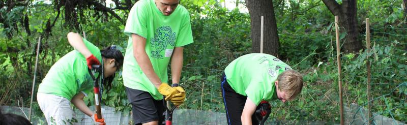 Fresh Start Day of Service Students digging in the ground