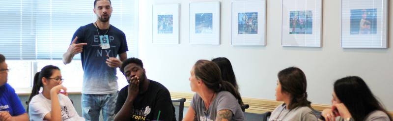 Students in a conference room during a meeting