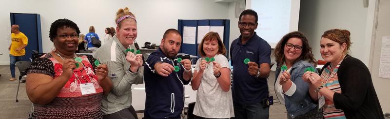 SFS Instructors holding green buttons