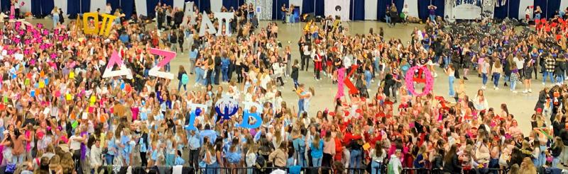 student on bid day in auditorium