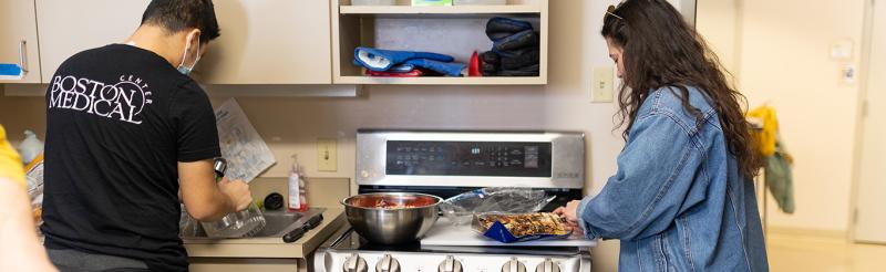 students preparing food in the kitchen