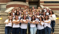 Sigma Alpha sisters pose together on campus